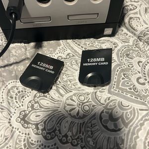 Vintage game cube with memory cards. Gently used.